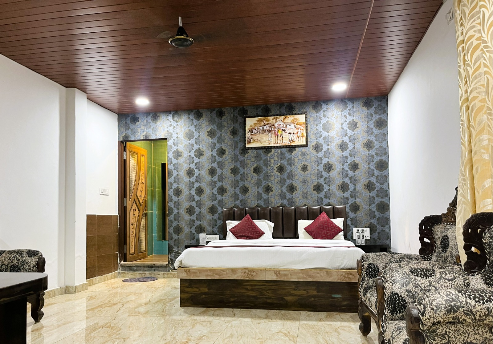 Cottage room with timber ceiling and patterned wall