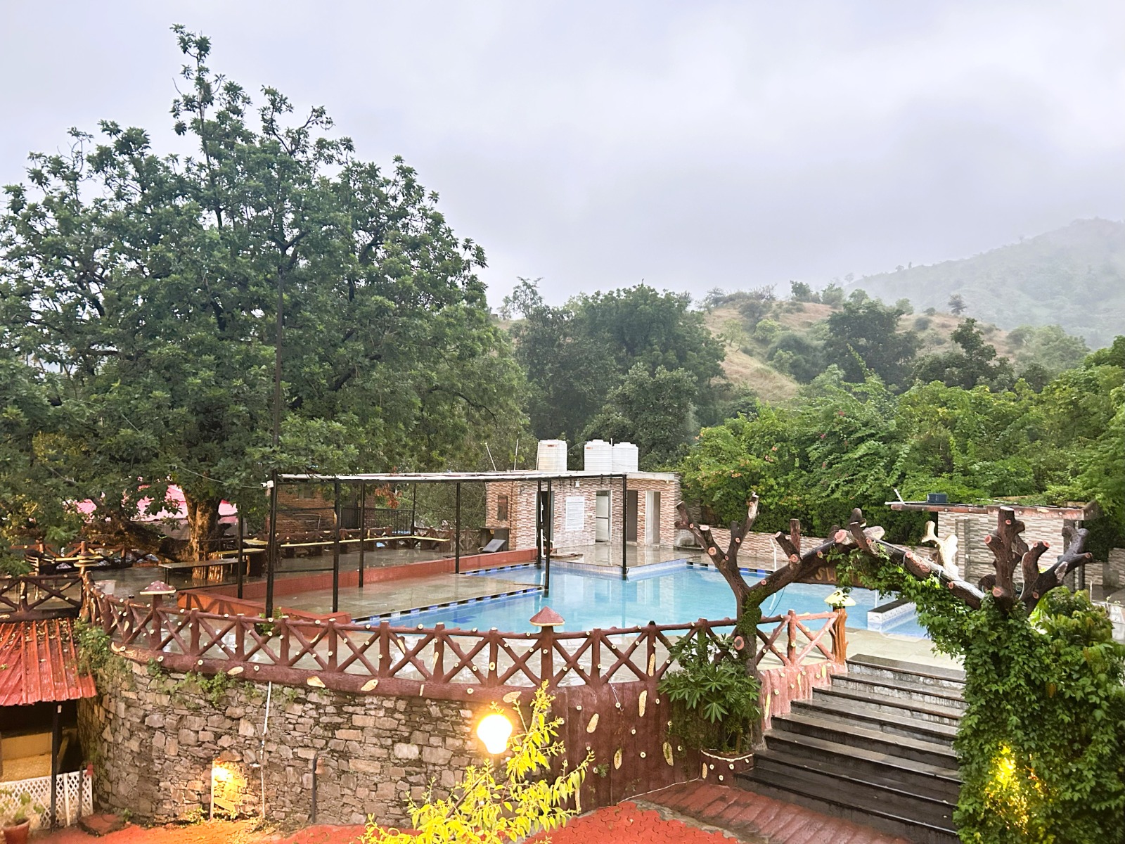 Resort pool overlooking the Aravalli hills